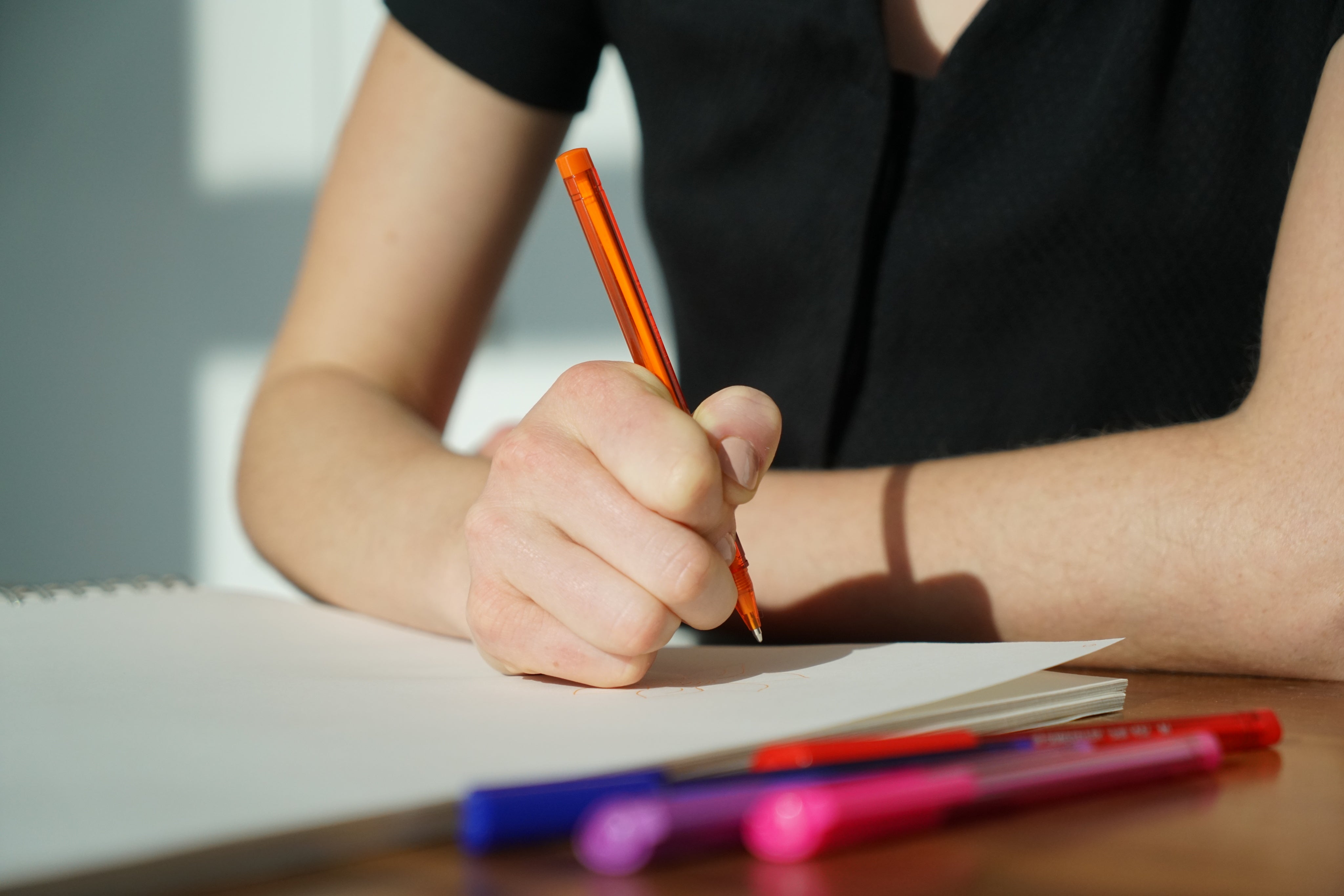 Person writing incident on notebook 